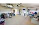 Well-organized garage with ample storage space, with a clean floor and convenient access to the laundry area at 26089 Seminole Lakes Blvd, Punta Gorda, FL 33955