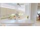 Bright kitchen with white cabinets, countertops, and modern appliances with natural light from above at 26089 Seminole Lakes Blvd, Punta Gorda, FL 33955