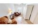 Cozy living room with comfortable seating, neutral tiled floors, and great natural light at 26089 Seminole Lakes Blvd, Punta Gorda, FL 33955