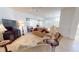 Inviting living room featuring neutral tones, tile flooring, and comfortable seating arrangements at 26089 Seminole Lakes Blvd, Punta Gorda, FL 33955
