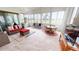Inviting sunroom featuring tiled floors and multiple seating areas for relaxation and entertainment at 26089 Seminole Lakes Blvd, Punta Gorda, FL 33955