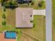 Aerial view of property showcasing the roof, driveway, and surrounding landscape, highlighting the spacious lot at 27038 San Jorge Dr, Punta Gorda, FL 33983