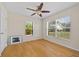Bright bedroom with hardwood floors, ceiling fan, and windows with natural light at 27038 San Jorge Dr, Punta Gorda, FL 33983