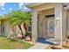 Inviting front entrance featuring a decorative glass door, decorative lanterns, and manicured landscaping at 27038 San Jorge Dr, Punta Gorda, FL 33983