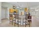 Kitchen featuring breakfast bar with stools, wood cabinets, and stainless steel appliances at 27038 San Jorge Dr, Punta Gorda, FL 33983