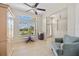 Bright living area with large windows, tile flooring, and comfortable seating arrangements at 27038 San Jorge Dr, Punta Gorda, FL 33983