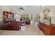 Open living room with tile floors, comfortable seating, and natural light from large windows at 27038 San Jorge Dr, Punta Gorda, FL 33983