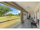 Spacious covered lanai with a view of the lush backyard at 27038 San Jorge Dr, Punta Gorda, FL 33983