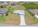Beautiful overhead view showcasing the well-manicured lawn and the home's proximity to surrounding residences at 27050 Pelotas Dr, Punta Gorda, FL 33983