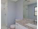 Bathroom featuring a shower, modern fixtures, granite counter, and a large vanity at 27050 Pelotas Dr, Punta Gorda, FL 33983