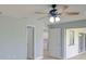 Bright bedroom with new floors, paint, ceiling fan, and two closets at 27050 Pelotas Dr, Punta Gorda, FL 33983