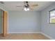 Bedroom with new floors, paint, a ceiling fan, a window, and closet at 27050 Pelotas Dr, Punta Gorda, FL 33983