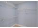 Walk-in closet with installed wire rack shelving and new floors at 27050 Pelotas Dr, Punta Gorda, FL 33983