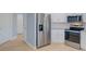 Well-appointed kitchen with modern stainless-steel appliances and sleek granite countertops at 27050 Pelotas Dr, Punta Gorda, FL 33983