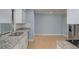 Modern kitchen featuring granite countertops, stainless steel appliances, and white cabinetry at 27050 Pelotas Dr, Punta Gorda, FL 33983