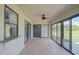 Florida room with tile floors and sliding glass doors at 27050 Pelotas Dr, Punta Gorda, FL 33983