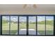 The backyard view as seen from the Florida room's sliding glass doors at 27050 Pelotas Dr, Punta Gorda, FL 33983