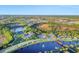 Aerial view of the community showcasing lakes, amenities, and the overall neighborhood layout at 281 Potenza Loop, Nokomis, FL 34275