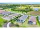 Aerial view showcases the property, landscaping, neighboring houses, and community features at 281 Potenza Loop, Nokomis, FL 34275