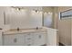 Bathroom features double sinks, modern fixtures, and a glass-enclosed shower with decorative tile at 281 Potenza Loop, Nokomis, FL 34275