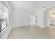 Light-filled bedroom with tile flooring, spacious layout, and an en-suite bathroom at 281 Potenza Loop, Nokomis, FL 34275