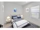 Comfortable bedroom features a queen bed, matching nightstands, and a window with natural light at 281 Potenza Loop, Nokomis, FL 34275