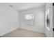 An empty bedroom with a window at 281 Potenza Loop, Nokomis, FL 34275