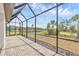 A screened lanai with brick patio, overlooking a pond at 281 Potenza Loop, Nokomis, FL 34275