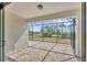 A screened in patio with brick floor and view to lake at 281 Potenza Loop, Nokomis, FL 34275