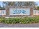 Community entrance sign for Vicenza by Neal Communities with lush landscaping at 281 Potenza Loop, Nokomis, FL 34275