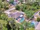 Aerial view of house with pool, backyard, and green surroundings at 3021 Toluca Ter, North Port, FL 34286