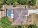 Birds eye view of the home featuring a screened pool and driveway at 3021 Toluca Ter, North Port, FL 34286