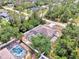 Aerial view of a home with a screened pool and fenced backyard at 3021 Toluca Ter, North Port, FL 34286