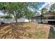 Spacious backyard featuring a screened-in pool area and privacy fence at 3021 Toluca Ter, North Port, FL 34286