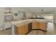 Kitchen leading into the living room and views of the outdoor pool at 3021 Toluca Ter, North Port, FL 34286