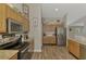 Well-equipped kitchen with stainless steel appliances and attractive wood-look flooring at 3021 Toluca Ter, North Port, FL 34286