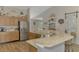 The kitchen has granite counters, stainless appliances, and bar seating for casual dining at 3021 Toluca Ter, North Port, FL 34286