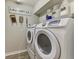 Laundry room with washer and dryer, and Laundry Co. Sign at 3021 Toluca Ter, North Port, FL 34286