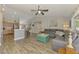 Spacious living room with modern furnishings, bar seating, and an open floorplan at 3021 Toluca Ter, North Port, FL 34286