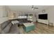 Inviting living room with comfortable seating and a view of the screened pool at 3021 Toluca Ter, North Port, FL 34286