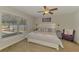 Bright primary bedroom with a queen bed and large windows at 3021 Toluca Ter, North Port, FL 34286