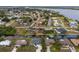 Aerial view of neighborhood with waterfront properties featuring canals, easy access to ocean, and well maintained yards at 3301 Santa Barbara Dr, Punta Gorda, FL 33983