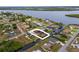 Aerial view of house with waterway access, pool, fenced backyard and easy access to green spaces at 3301 Santa Barbara Dr, Punta Gorda, FL 33983