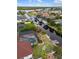 Aerial shot of a home with a screened pool, beautiful landscaping, and a private dock on the canal at 3301 Santa Barbara Dr, Punta Gorda, FL 33983