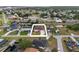Aerial view of home featuring waterfront access, manicured lawn, and mature landscaping in a waterfront community at 3301 Santa Barbara Dr, Punta Gorda, FL 33983