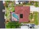 Aerial perspective showcasing home layout, screened pool, lush backyard, and convenient dock access at 3301 Santa Barbara Dr, Punta Gorda, FL 33983