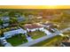 Beautiful aerial view of waterfront homes with well-maintained lawns and canal access at sunset at 3301 Santa Barbara Dr, Punta Gorda, FL 33983
