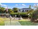 A waterfront backyard with hammock, dock, and lush greenery at 3301 Santa Barbara Dr, Punta Gorda, FL 33983