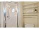 Updated shower featuring sleek tiles and shelves at 3301 Santa Barbara Dr, Punta Gorda, FL 33983
