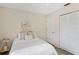 Bedroom featuring light walls, a bed, closet, and a bedside table at 3301 Santa Barbara Dr, Punta Gorda, FL 33983